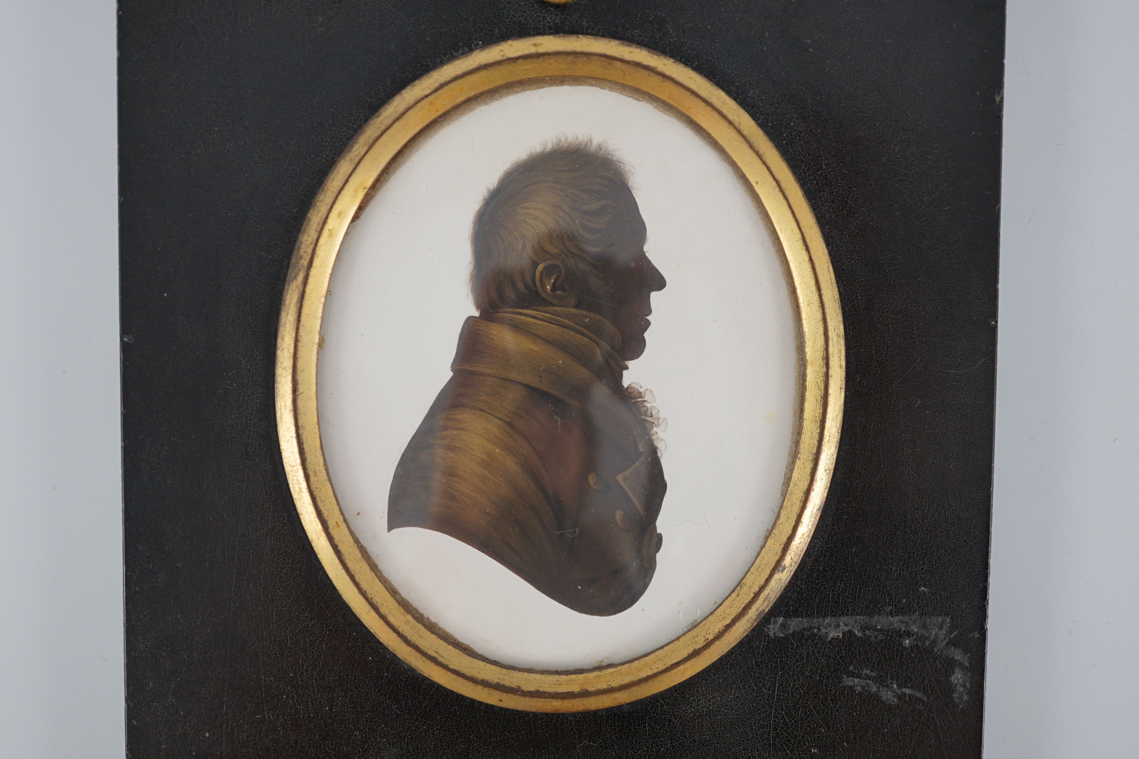 John Miers (1756-1821), Silhouette of a gentleman, painted and bronzed plaster, 7.9 x 6.5cm.